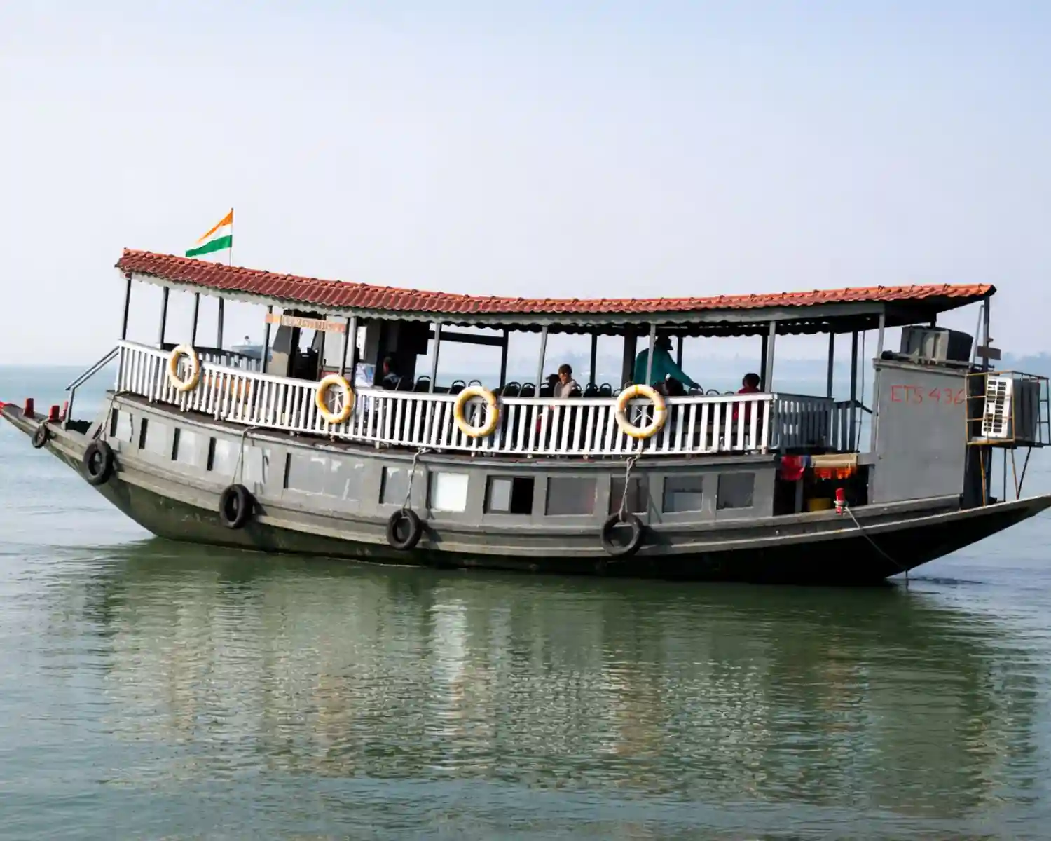 Luxury AC boat safari cruising through Sundarban rivers during Sundarban tour.