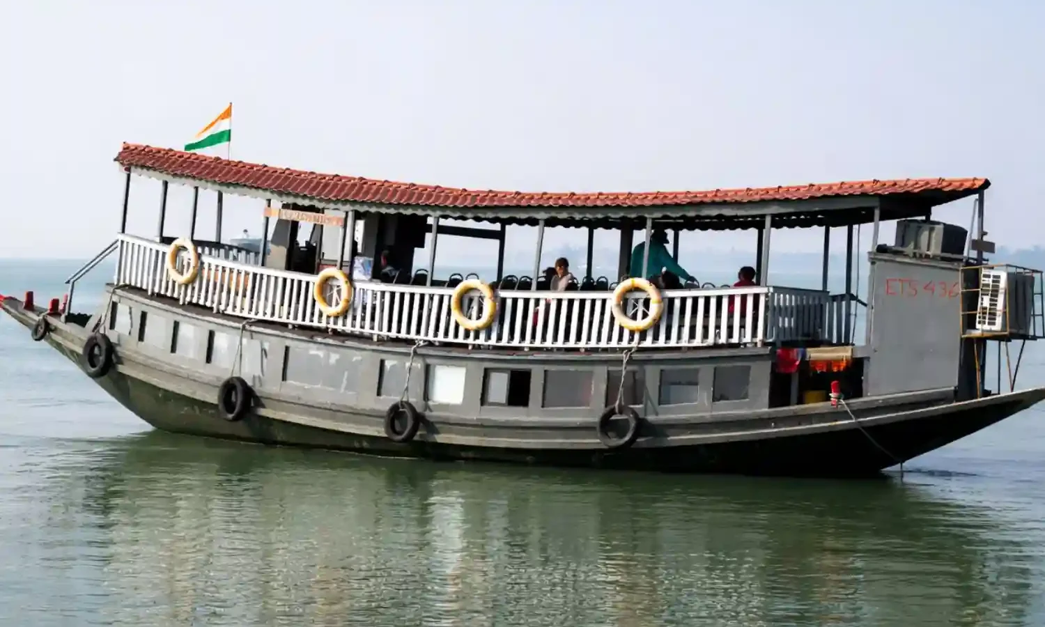 Luxury AC boat safari cruising through Sundarban rivers during Sundarban tour.
